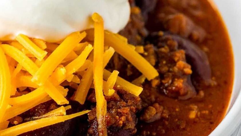 Bowl of Chili with Cornbread and Toppings